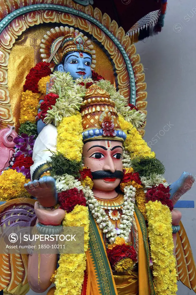 Singapore, , Colourful Statue Decorated With Flower Garlands At An Indian Hindu Temple