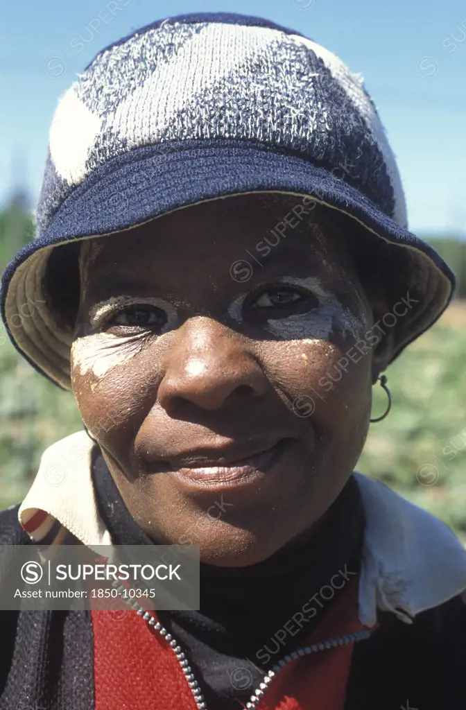 South Africa, Western Cape, Stellenbosch, Portrait Of A Female Agricultural Farm Worker At Mooiberg Fruit And Vegetable Farm