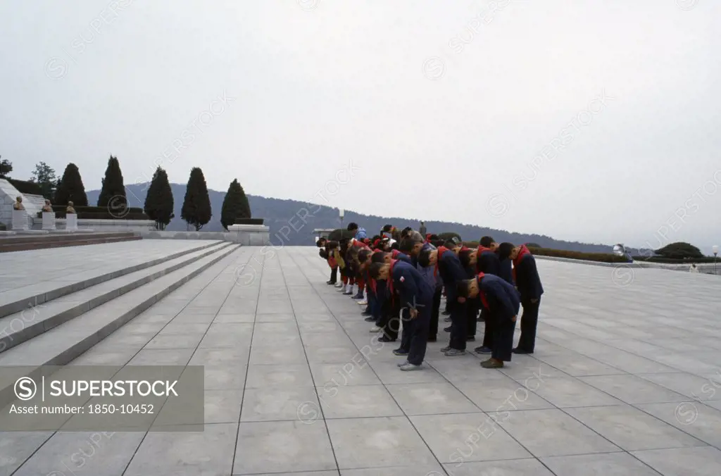 North Korea, Pyongyang, Group Of Children Paying Their Respects At The Tomb Of The Martyrs Outside The City.
