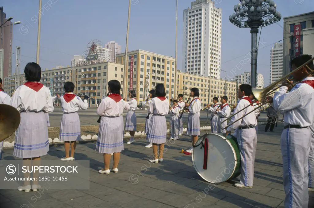 North Korea, Pyongyang, Juche Ideology.  Band Playing Outside The Railway Station To Encourage Workers And Travellers.