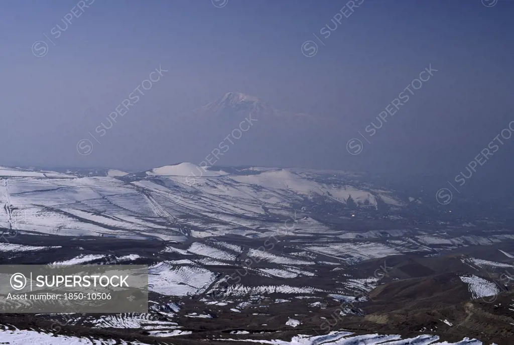 Armenia, Mount Ararat, Aerial View Over Mount Ararat In Turkey From Vokhchaberd With Polluted Air From Yerevan On The Right.