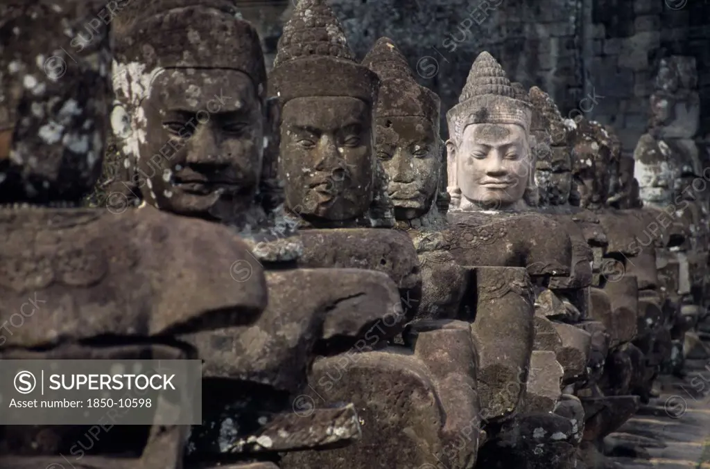 Cambodia, Siem Reap, Angkor Thom, South Gate Causeway Lined With Statues Of Various Gods The Paler Faced One Recently Restored
