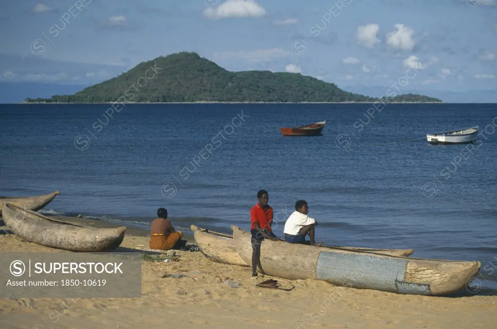 Malawi, Lake Malawi, Cape Maclear.  Boys With Fishing Boats.