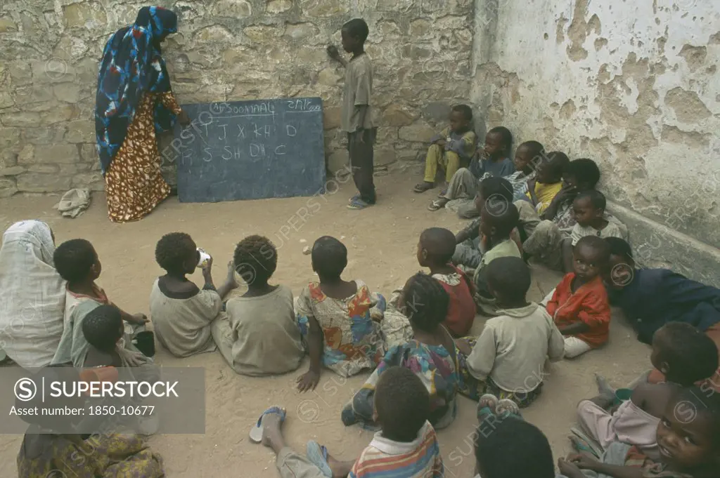 Somalia, Baidoa, Teacher With Pupils In Outdoor Classroom At School In Baidoa Orphanage.