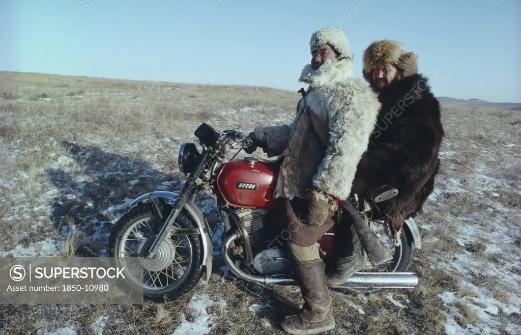 Mongolia, Transport, Mongol Ton Up Men On Motorbike Dressed In Fur Clothes.