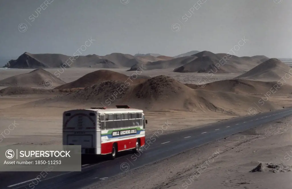 Peru, Landscape, Bus On The Pan American Highway Through Coastal Desert Connecting Ecuador And Chile.