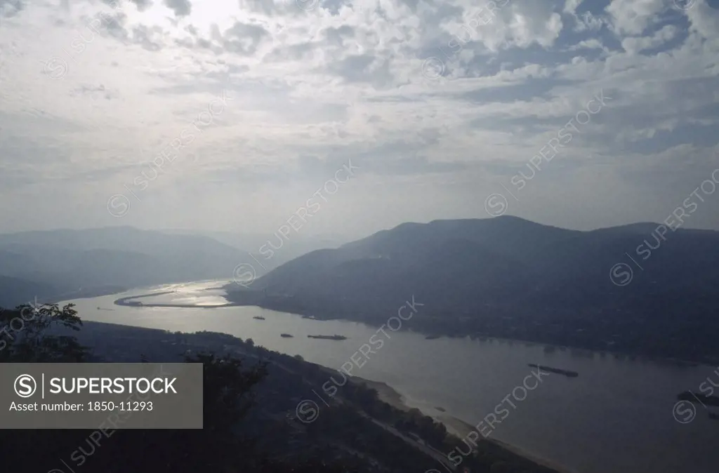 Hungary, River Danube, Bend In River And Surrounding Landscape In Low Light.