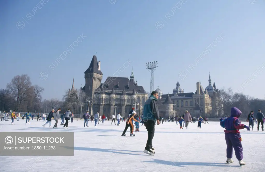 Hungary, Budapest, Ice Skaters On Outdoor Rink.