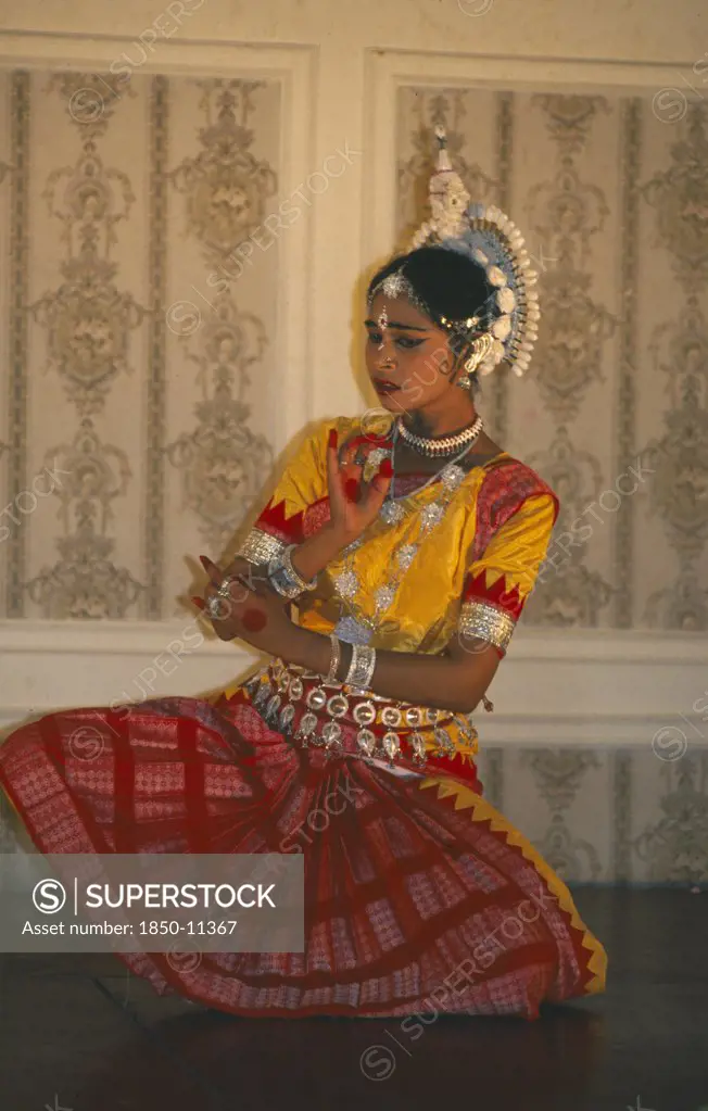 India, Orissa, Clasical Indian Dancer Performing Odissi Temple Style Dance.