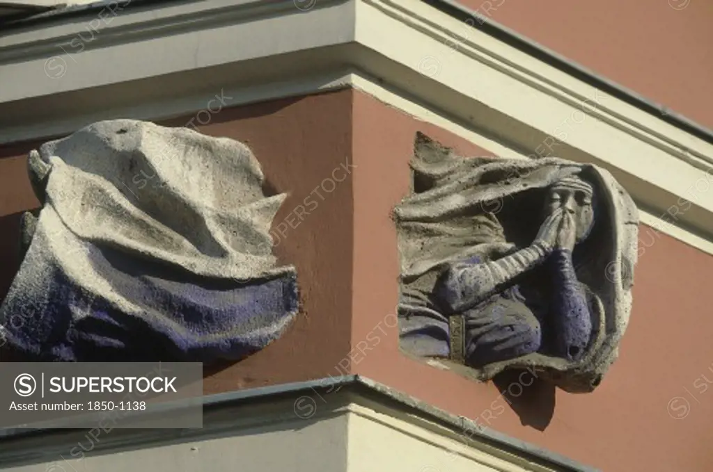 Hungary, Budapest, Building Detail Showing A Flying Nun Passing Through The Corner Of A Building