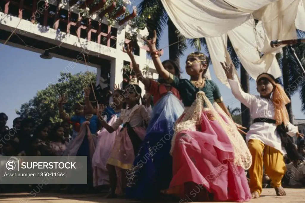 India, Goa, Margao, Children Dressed As Adults Performing Dance During Carnival.