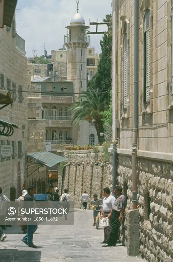 Israel, Jerusalem, Old City East, Via Dolorosa Narrow Street Lined With Shops. Aka The Way Of Suffering. Said To Be The Route That Jesus Carried His Cross To The Crucifixtion Site