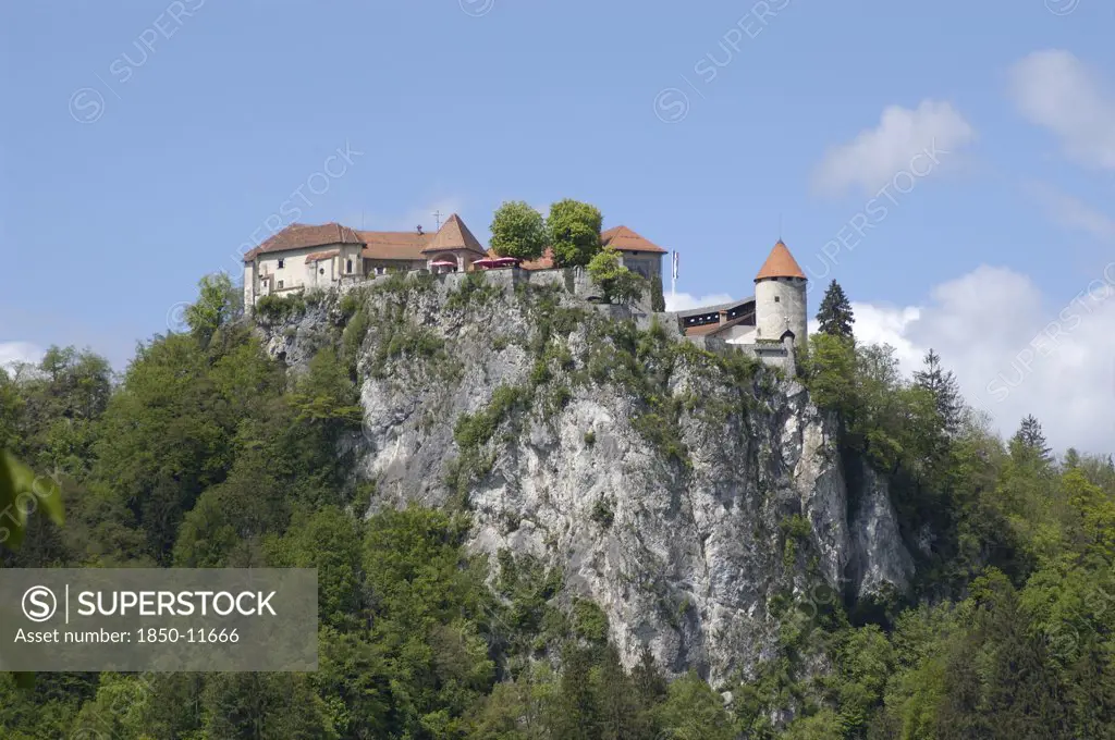 Slovenia, Lake Bled, Bled Castle Perched On High Cliffs Above The Lake
