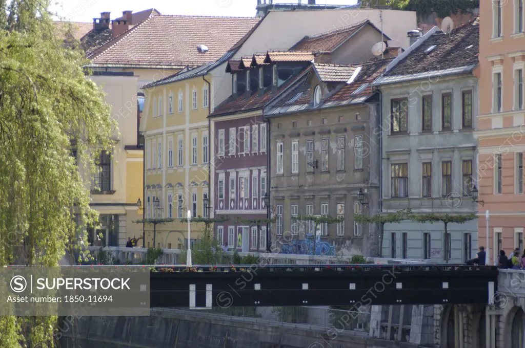 Slovenia, Ljubljana, River Ljubljanica. View Along Row Of Austro Hungarian Buildings Toward The Old Town