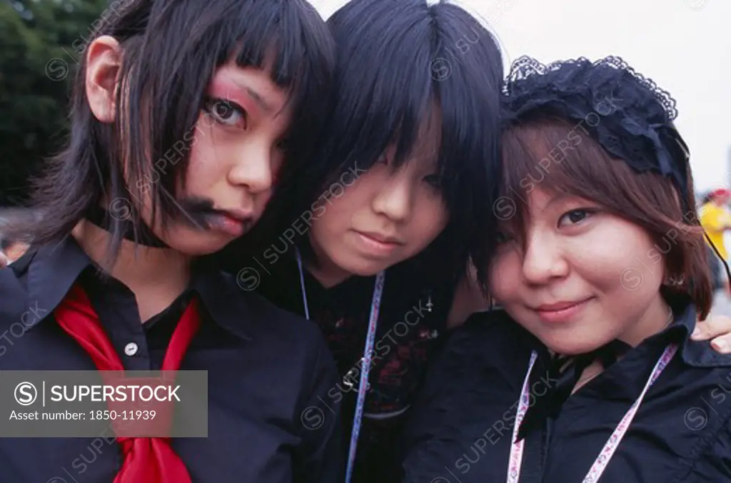 Japan, Honshu, Tokyo, Harajuku District. Portrait Of Three Girls Dressed In Teenage Japanese Style