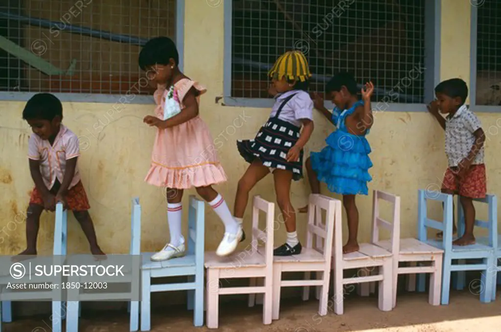 Sri Lanka, Colombo, Children Learing To Count Through Game Playing.