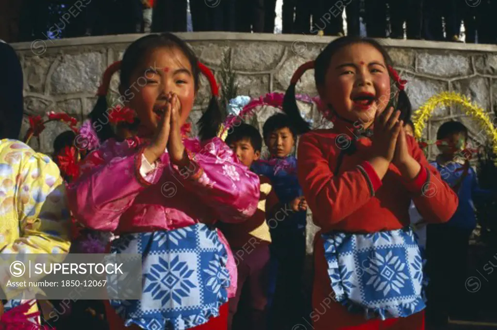 China, Yunnan Province, Tribal People, Two Small Girls Performing Song.