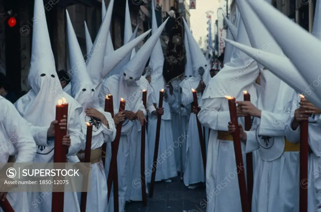 Spain, Andalucia, Seville, Penitents In Holy Week Procession