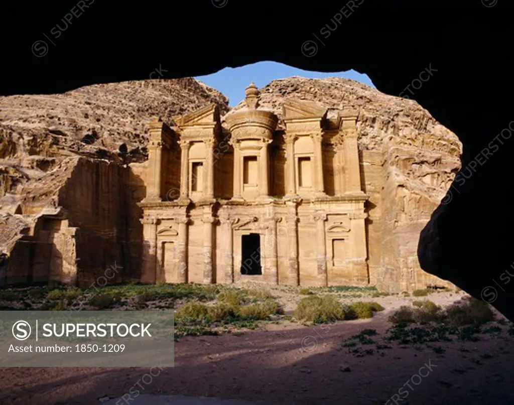 Jordan, Petra, The Monastery Carved From Rock Face Framed By Rock Arch.