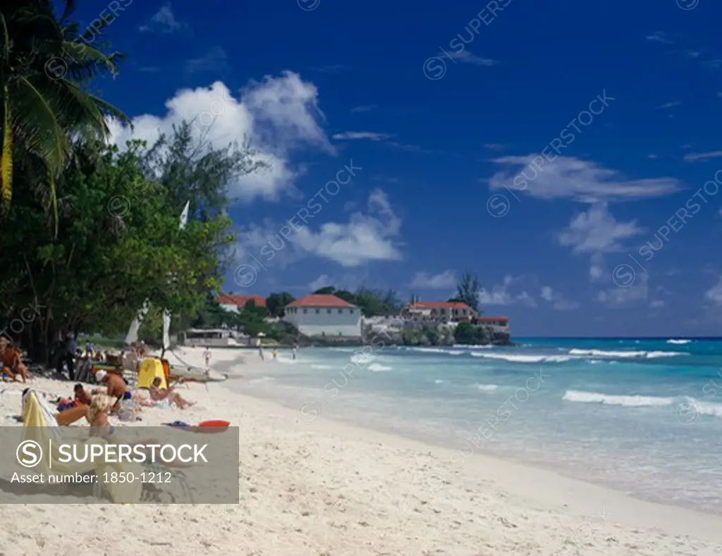 Barbados, Christchurch, Sunbathers On Sandy Beach