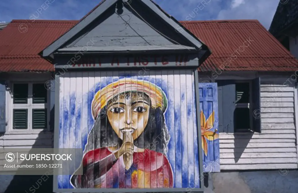 West Indies, Windward Islands, Dominica, Roseau.  Mural On Exterior Of Bread Shop In The Centre Of The Capital.