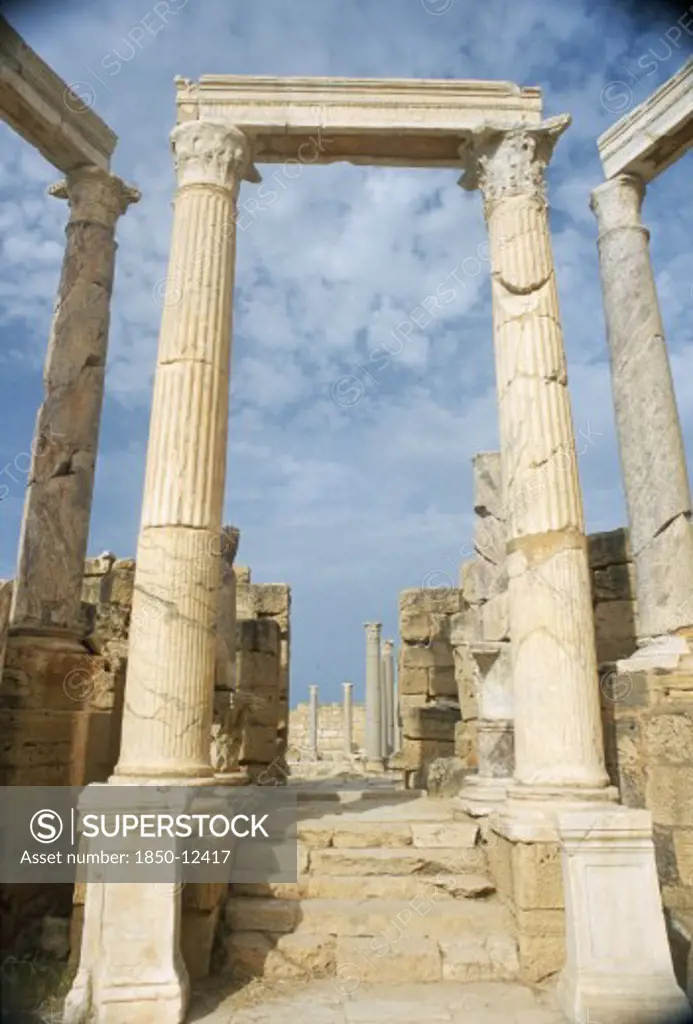Libya, Tripolitania, Leptis Magna, Ruins Of Roman City Founded In 6Th Century Bc.  Carved Columns And Masonry In The Theatre.