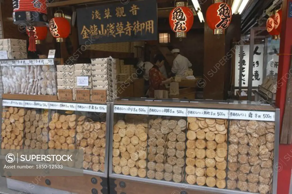 Japan, Honshu, Tokyo, 'Asakusa. Nakamise-Dori Leading To Senso-Ji Temple, A Traditional  ''Sembei'' Grilled Rice Cracker Shop Displays Wares'