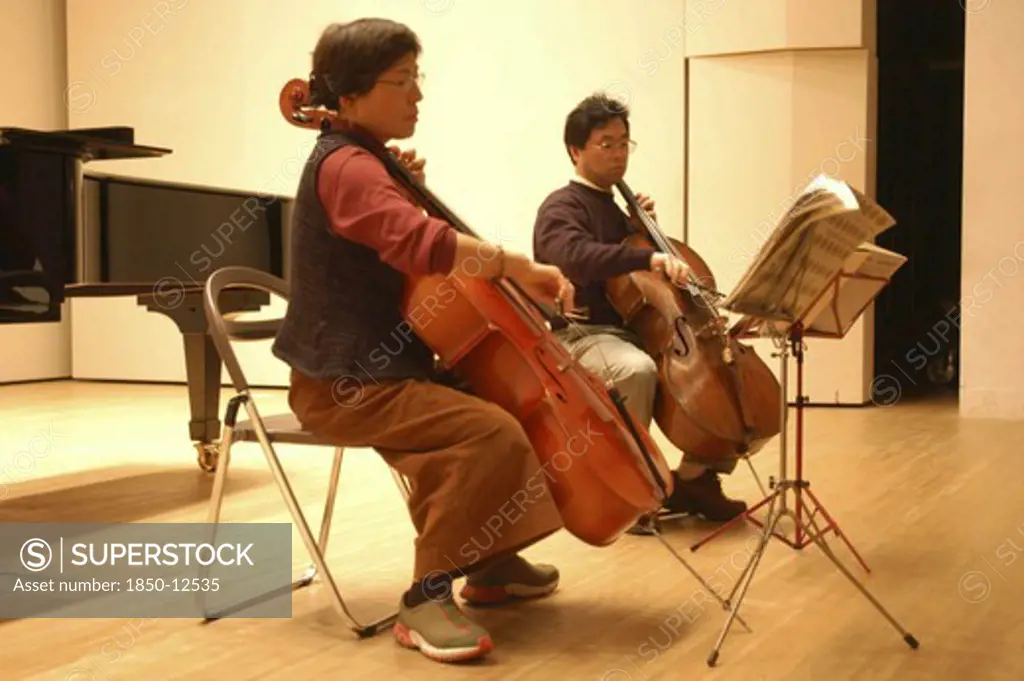 Japan, Chiba, Tako, '53 Year Old Public Health Nurse Named Teruko Ui Plays Cello With Teacher Satoshi Miyano, At Recital As A Hobby And For Relaxation'