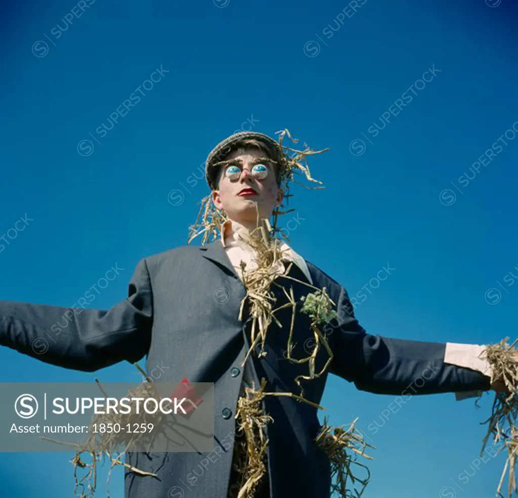 Agriculture, Scarecrow, Human Scarecrow With Straw Stuffed Jacket.