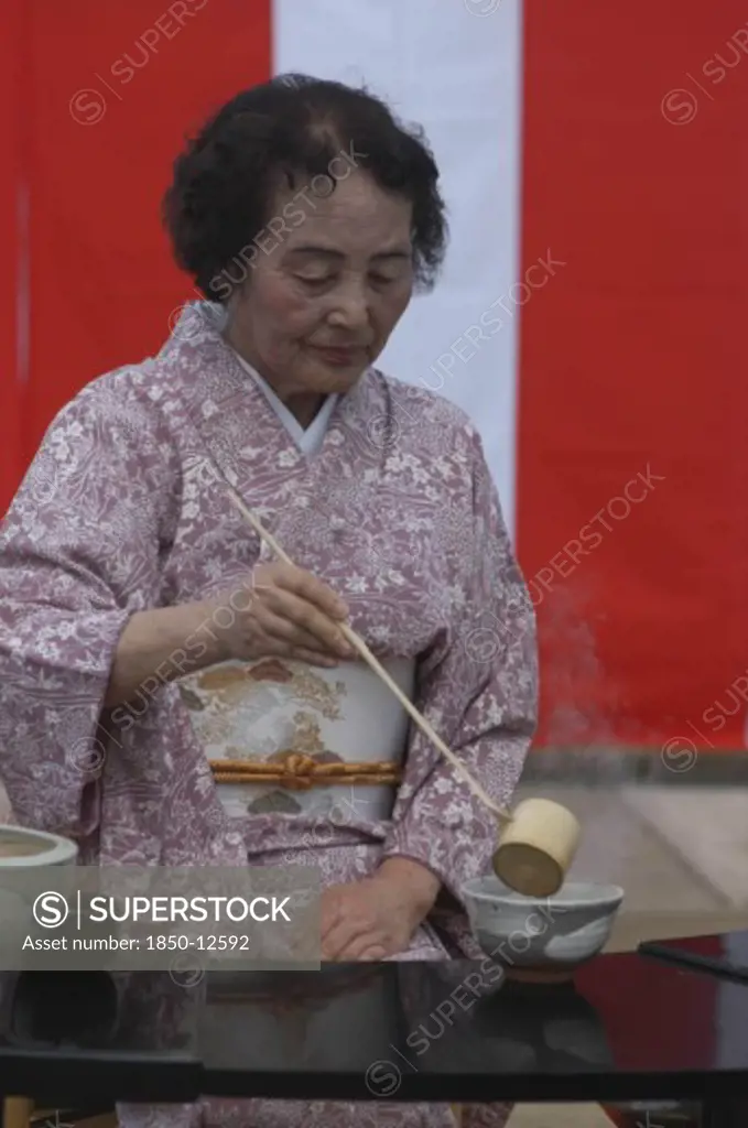 Japan, Chiba, Yokaichiba, 'Licensed Tea Master Shikako Namba Prepares Green Tea ''Macha'' At A Tea Ceremony, Senior Citizen, Wearing Kimono'
