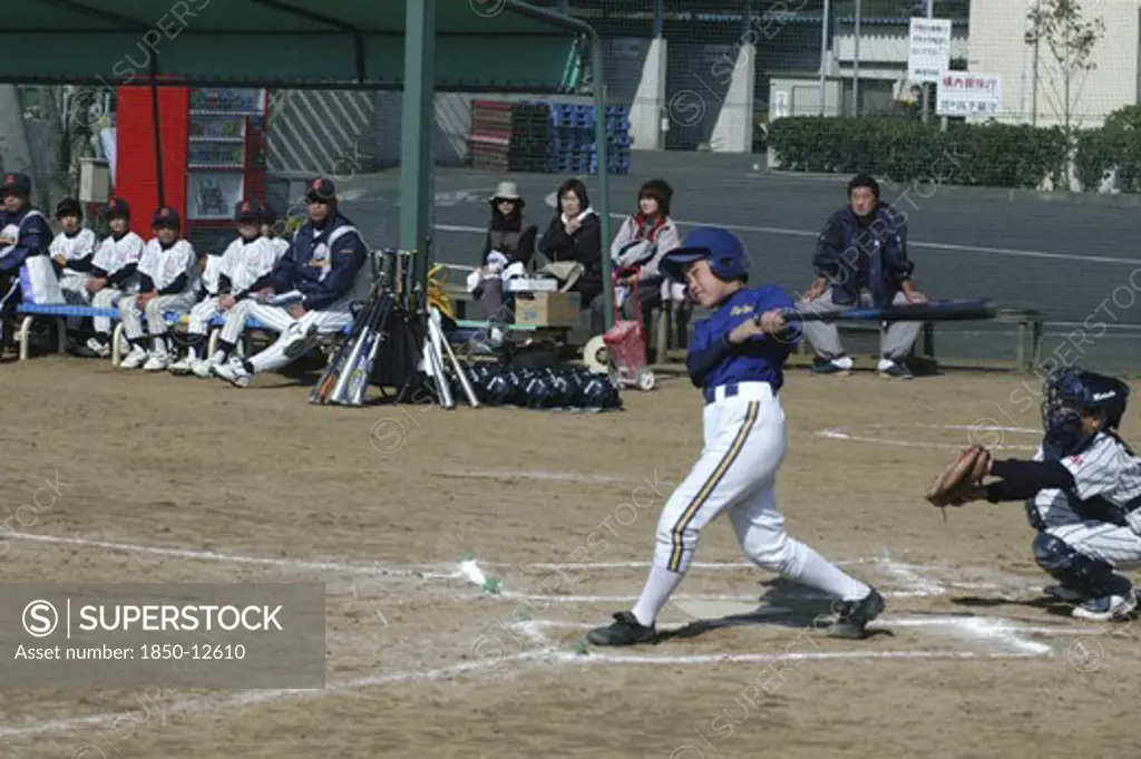 Japan, Chiba, Tako, 'Captain Toshiki Hagiwara, 12 Year Old 6Th Grader,  Watches The Ball Go For Toujou Shonen Yakyu Club, Youth League Baseball '