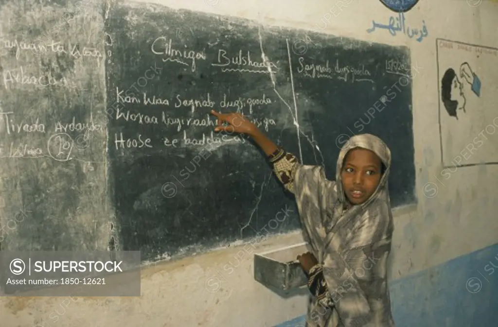 Somalia, Baidoa, Dr Ayub Primary School.  Pupil At Blackboard.