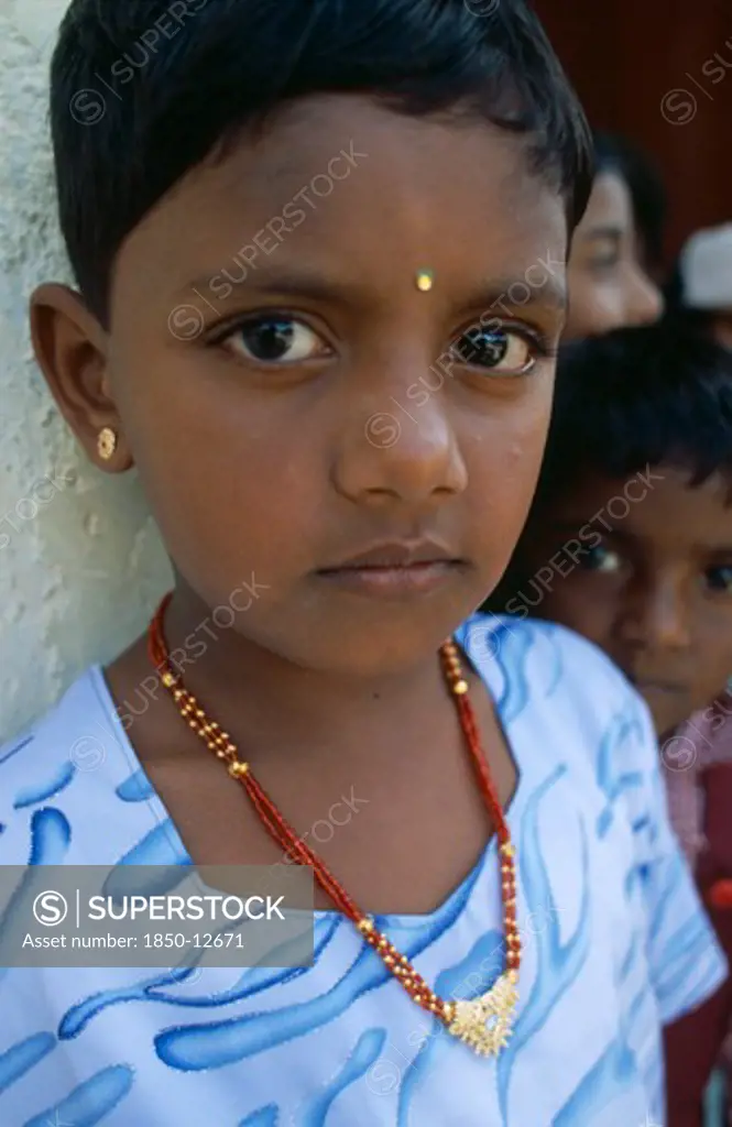 Sri Lanka, Dambetenne, Portrait Of A Young Schoolgirl Wearing Gold Jewellery