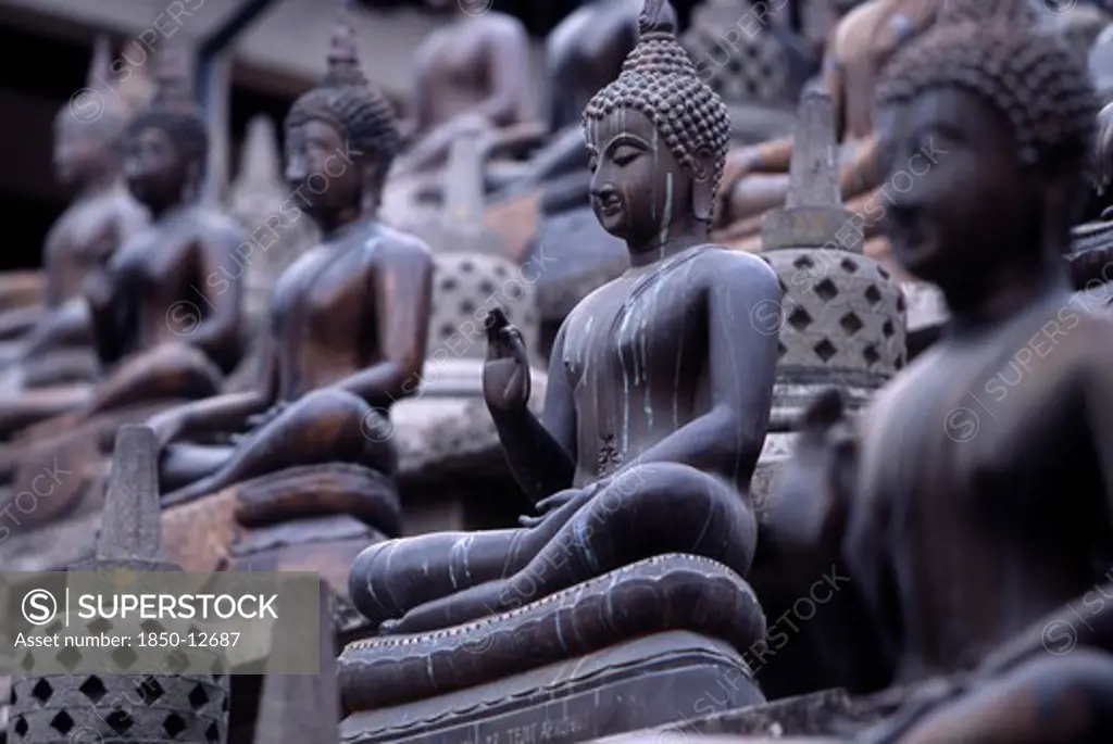 Sri Lanka, Colombo, Gangaramaya Temple. Mass Of Seated Buddha Statues