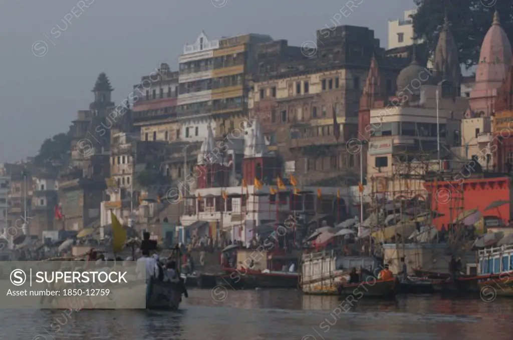 India, Uttar Pradesh, Varanasi , Dashaswamedh Ghat On The Ganges River Looking South With Boats And Bathers