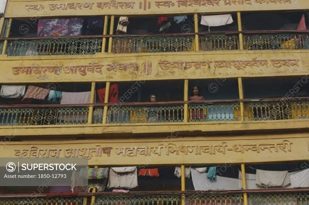 India, Uttar Pradesh, Varanasi , Dashaswamedh Ghat. Women On The Balcony Of An Apartment Block