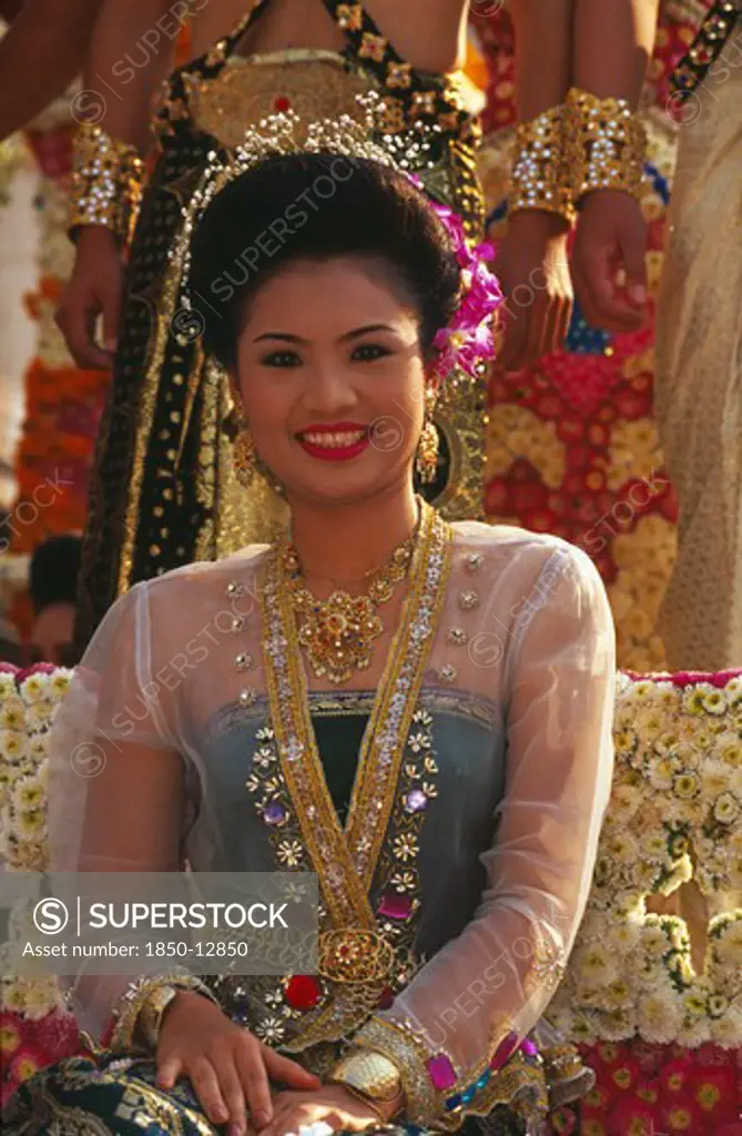 Thailand, Chiang Mai, Portrait Of Young Woman Riding The Beauty Contest Float In The Flower Festival Parade