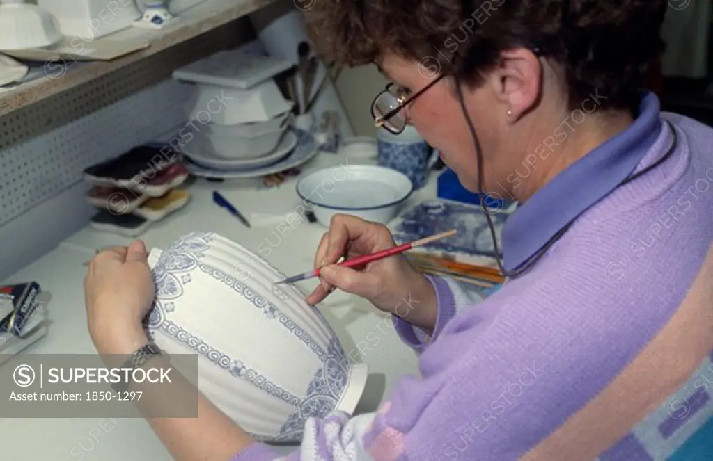 Holland, Industry, Delftware, Female Worker Painting Design Onto Delftware Vase.