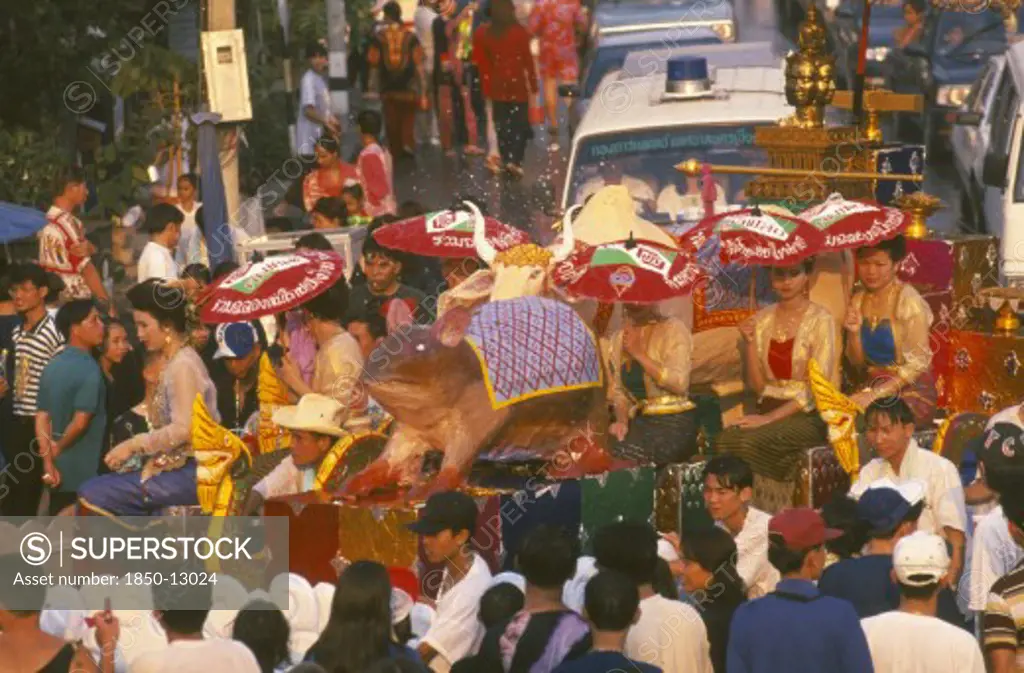 Thailand, Chiang Mai, Songkran Aka Thai New Year Festival Parade To Wat Phra Singh With Floats Depicting The Years Of The Rat And Ox
