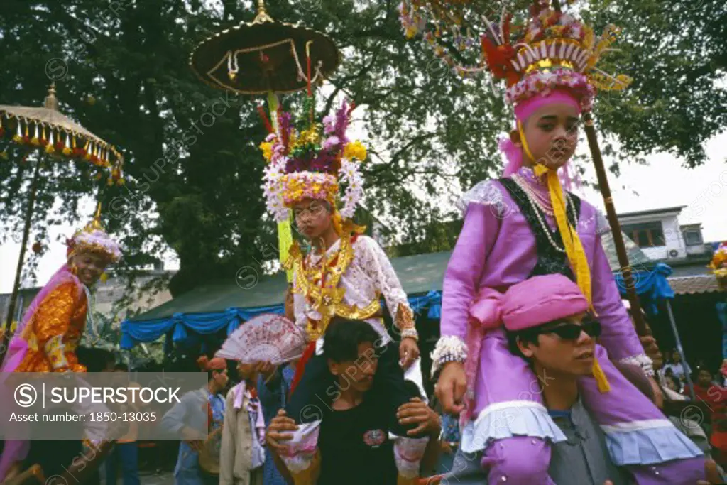 Thailand, Chiang Mai, Shan Poi San Long. Crystal Children Ceremony With Luk Kaeo In Costume Being Carried On Mens Shoulders At Wat Pa Pao