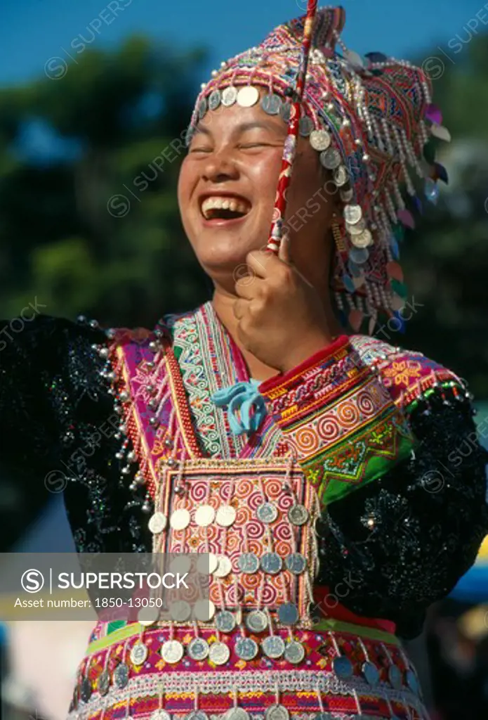Thailand, Chiang Mai, Hmong New Year. Young Blue Hmong Woman In Her New Year Finery Laughing