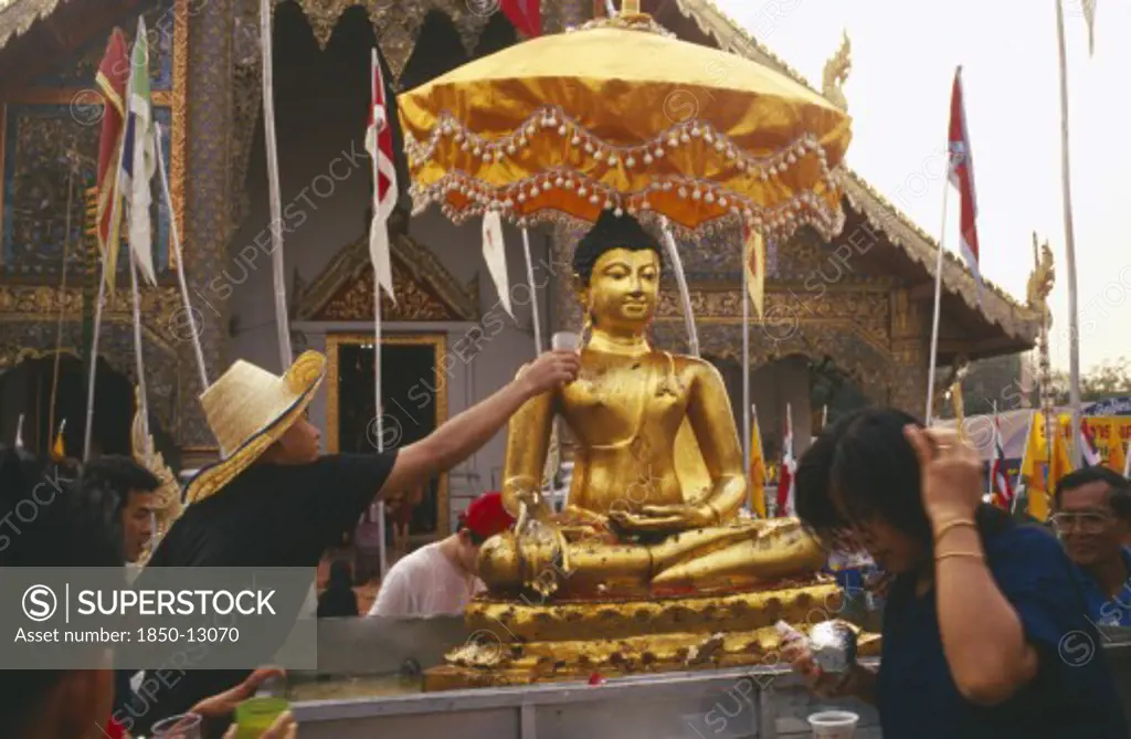 Thailand, Chiang Mai, Wat Phra Singh, Sihing Buddha Statue Being Bathed With Lustral Water