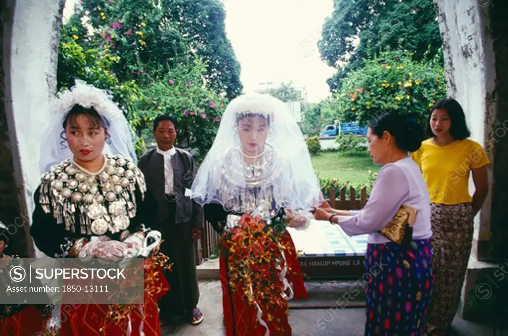 Myanmar, Kachin State, Myitkyina, Jinghpaw Wedding With Bride And Bridesmaid Entering The Geis Memorial Church