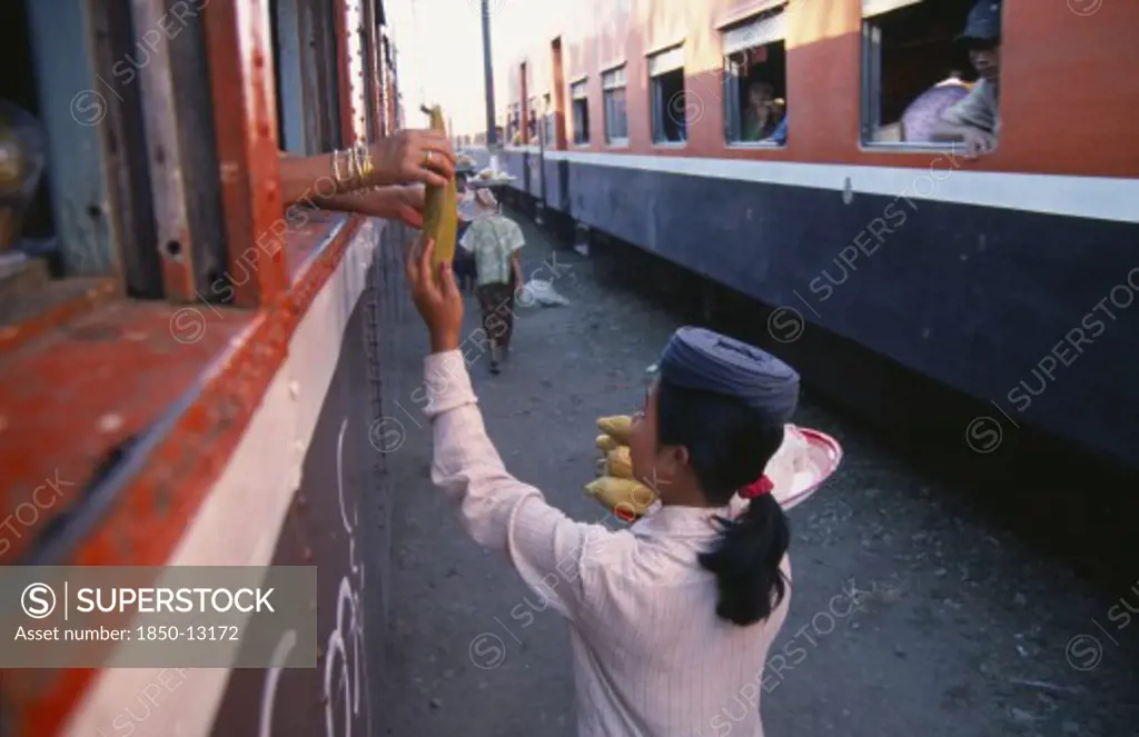 Myanmar, Markets, Female Vendor Selling Sweet Corn To Passengers On The Mandalay To Myitkyina Train.