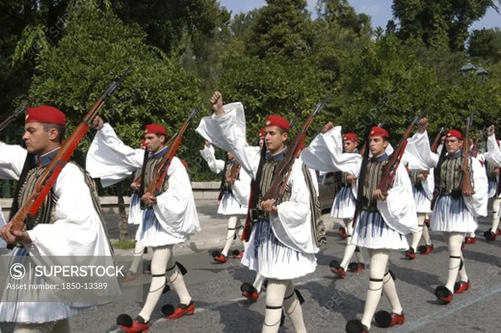 Greece, Athens, Evzone Soldiers In Uniform Marching In The Street
