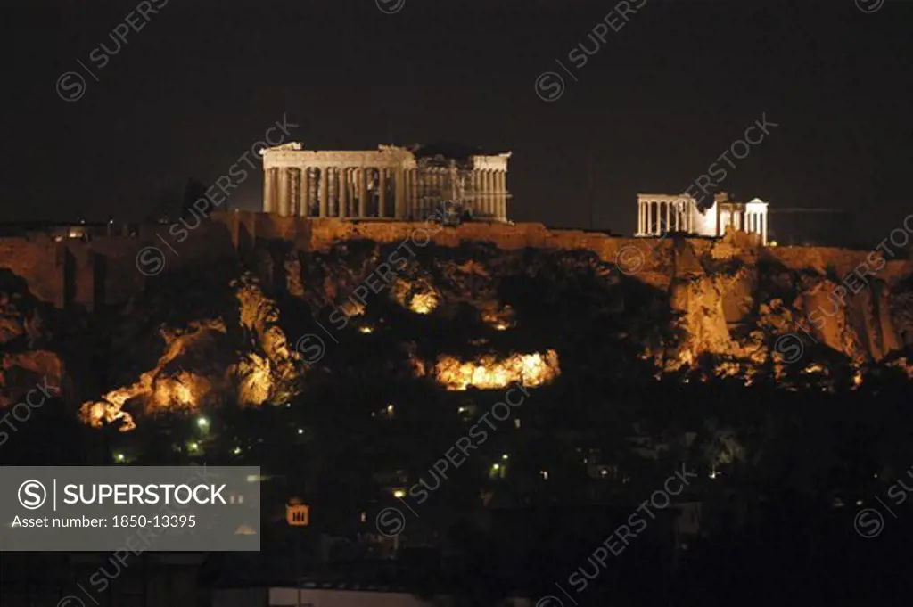 Greece, Athens, View Toward The Hilltop Acropolis With The Parthenon And Other Ruins Illuminated At Night