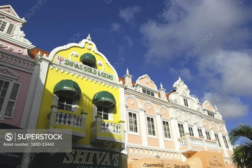 West Indies, Dutch Antilles, Aruba, Oranjestad. Colourful Colonial Style Facades Of Perfumerie And Jewellery Shops