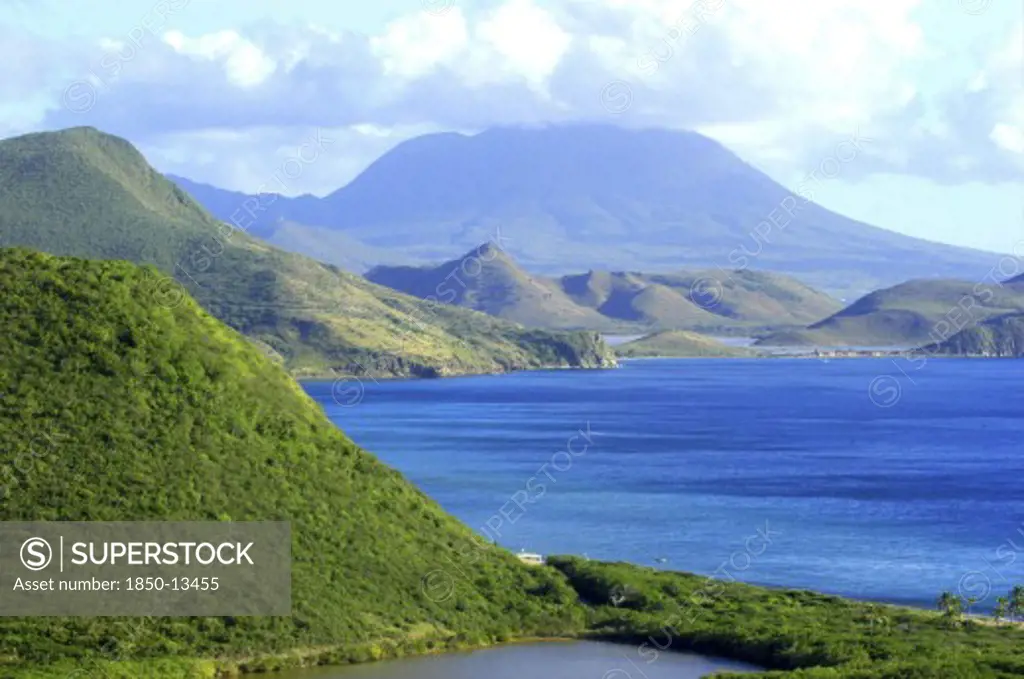 West Indies, St Kitts, View Over Green Hilly Coastline And Blue Sea