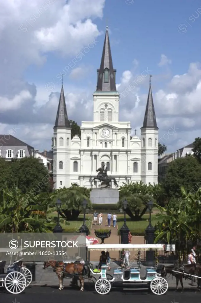 Usa, Louisiana, New Orleans, French Quarter. St Louis Cathedral On Jackson Square With Horse Drawn Carriages In The Foreground