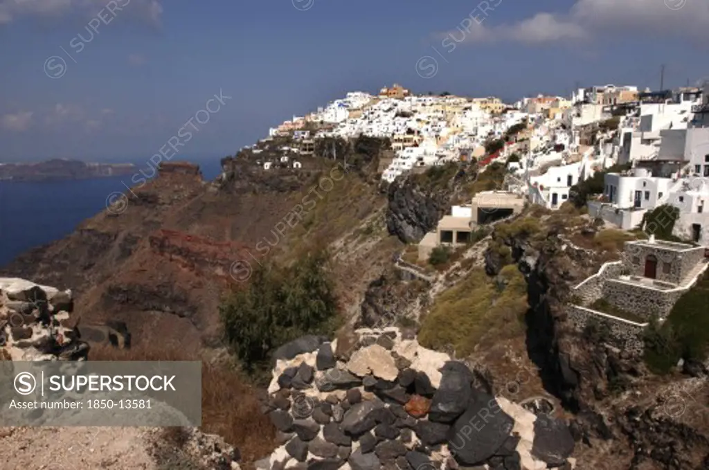 Greece, Cyclades, Santorini, Town Atop Rugged Coastal Cliffs